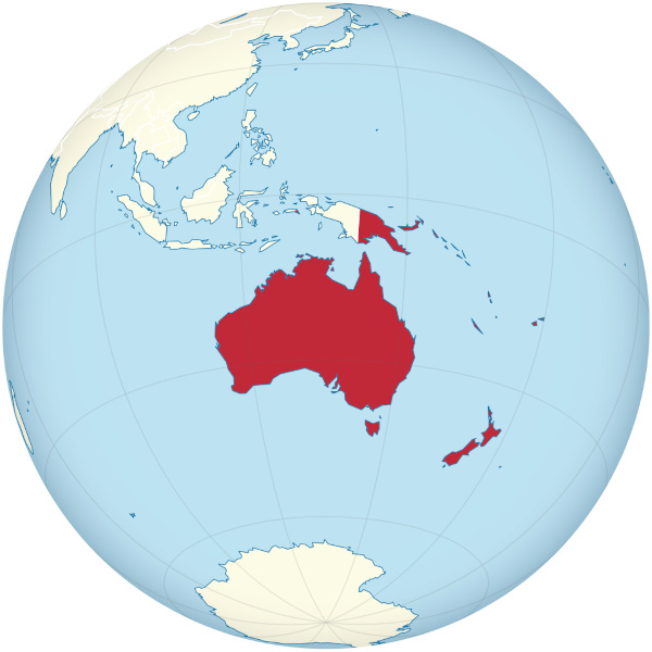 Mapa-múndi com a Oceania destacada em vermelho